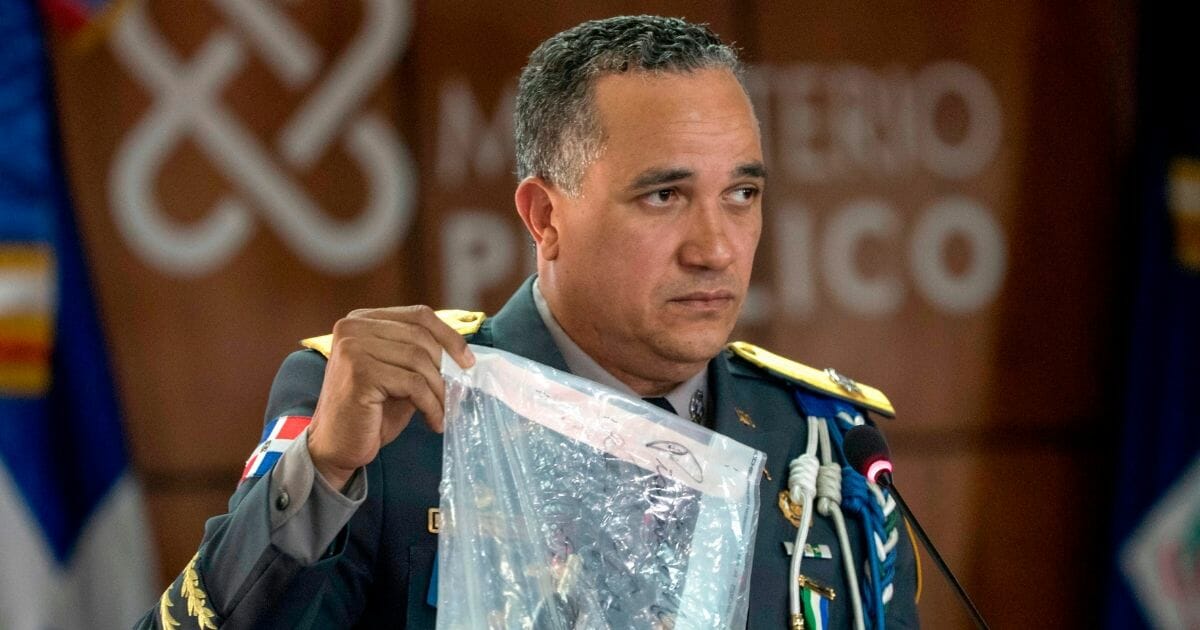 Dominican Republic's National Police Director Ney Aldrin Bautista Almonte shows evidence at a news conference June 12, 2019, in regard to the shooting of ex-Major League Baseball player David Ortiz in Santo Domingo.