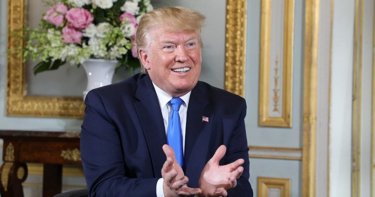 President Donald Trump gestures during a meeting with French President Emmanuel Macron in Normandy, France, on Friday, June 6, 2019.