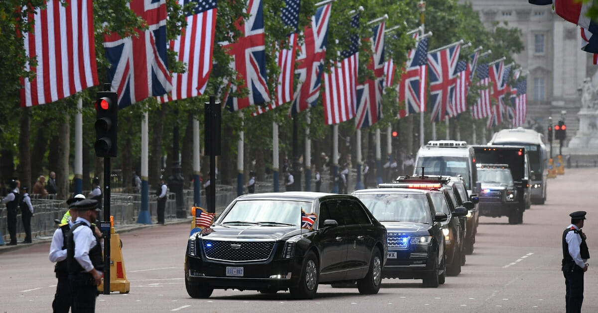 President Donald Trump and first lady Melania Trump travel along the mall in their motorcade after leaving Buckingham Palace to travel to Westminster Abbey in central London on June 3, 2019.
