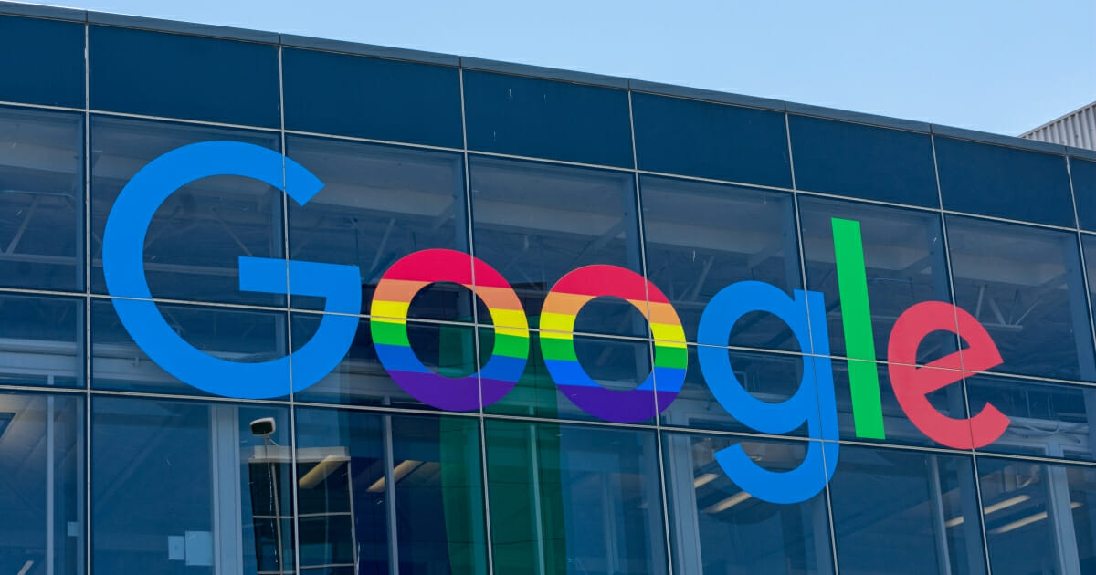 Google's logo, with rainbows for LGBT Pride Month, is displayed on the company's headquarters in Mountain View, California.