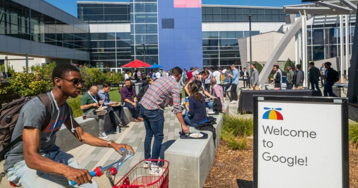 Google employees working outside the company's Googleplex headquarters in Mountain View, Calif.