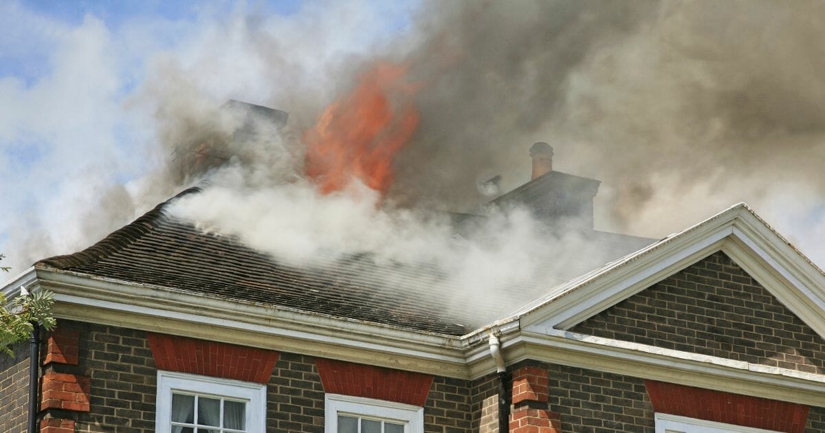Roof of a house on fire.