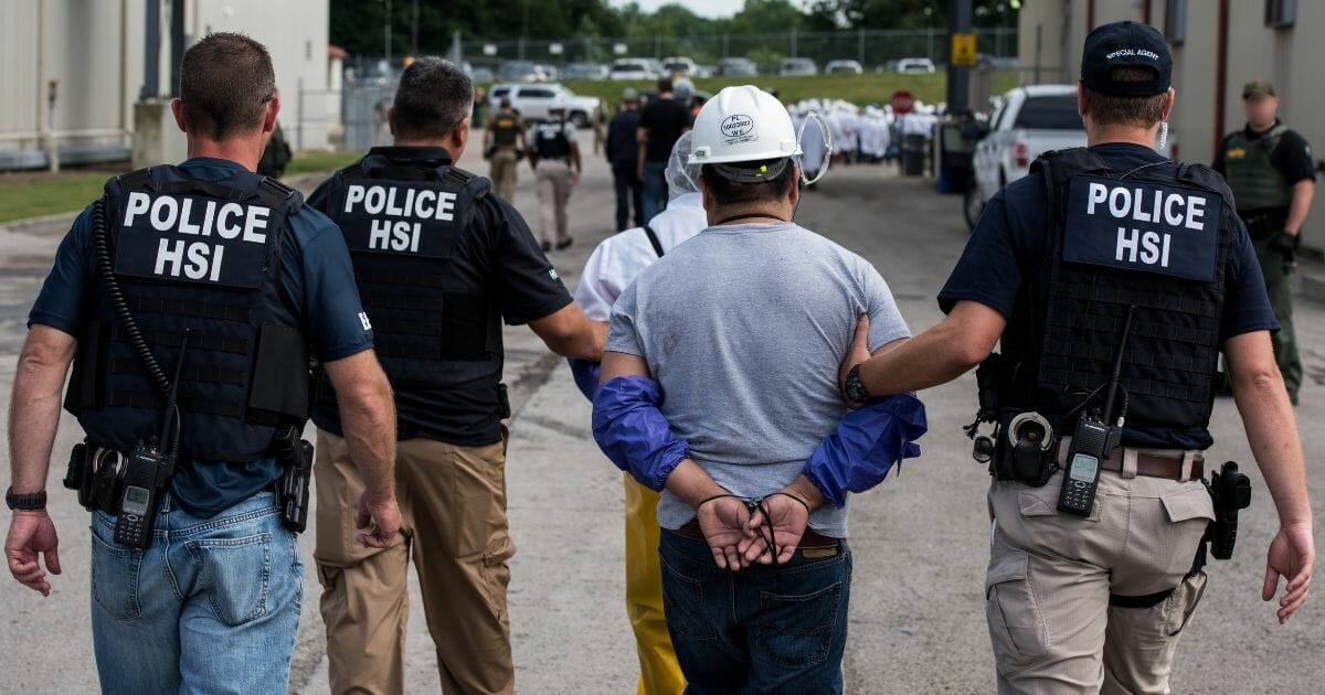 U.S. Immigration and Customs Enforcement's Homeland Security Investigations special agents arrest alleged immigration violators at Fresh Mark in Salem, Ohio, on June 19, 2018.