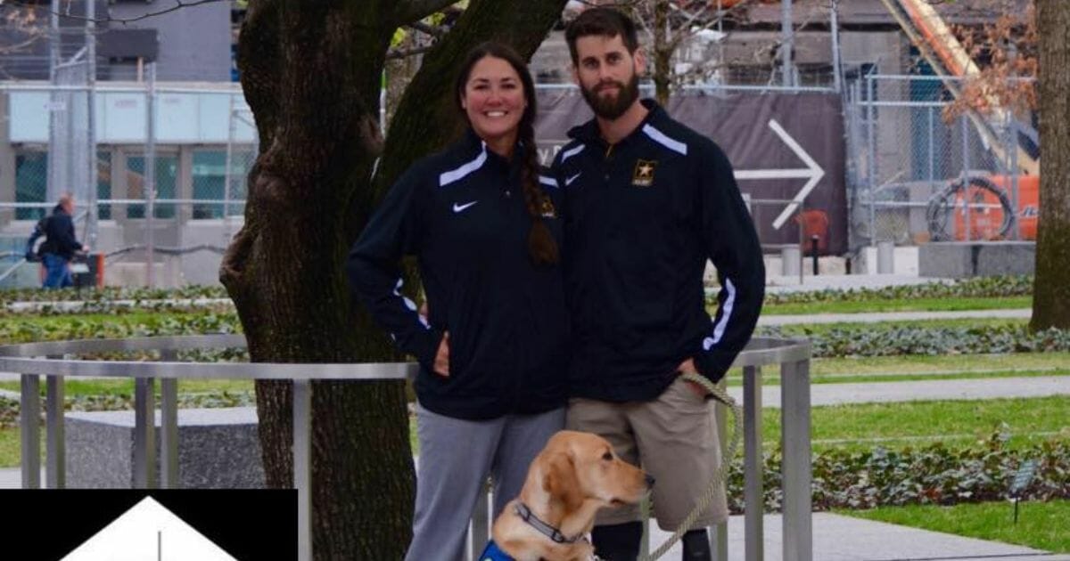 Katie and Stefan LeRoy with their service dog.