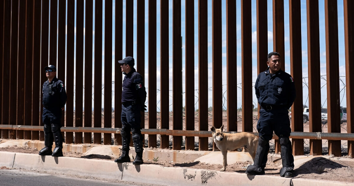 Mexico's federal police stand guard at the U.S.-Mexico border fence as President Donald Trump visits Calexico, California, as seen from Mexicali, Baja California state, Mexico, on April 5, 2019.