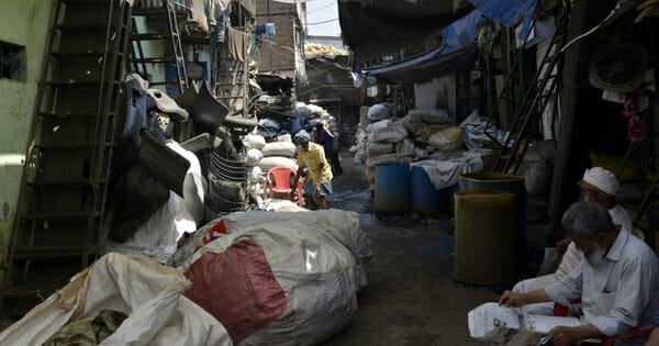 This picture taken on March 7, 2019 shows sacks of plastic waste arranged outside a factory in Dharavi, Asia's largest slum in Mumbai.