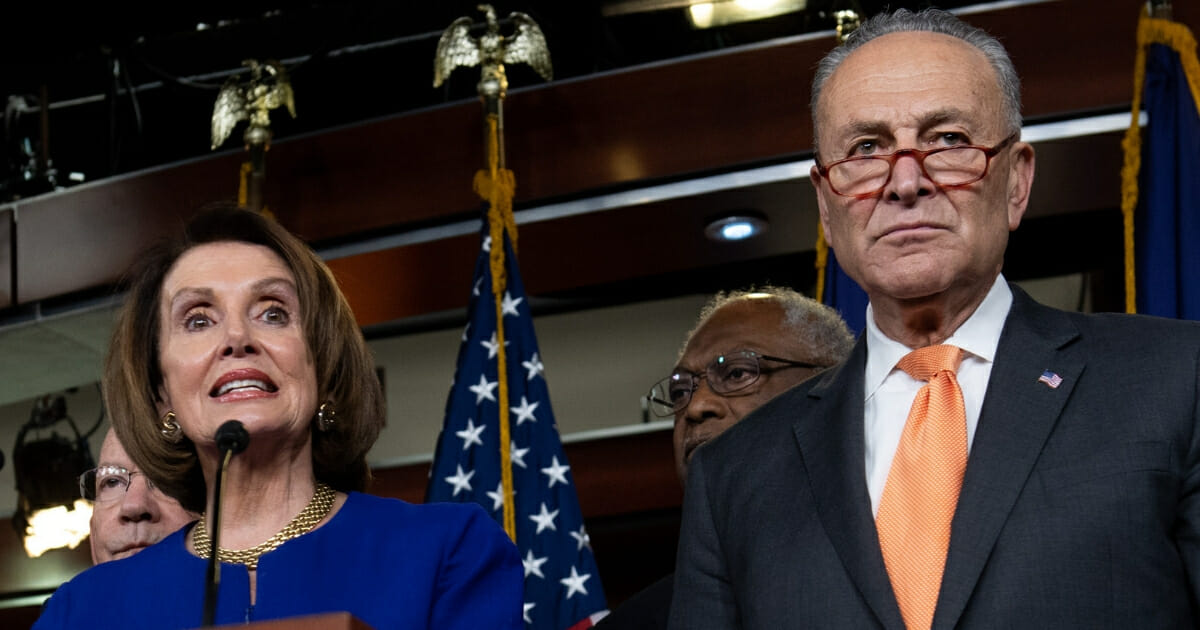 House Speaker Nancy Pelosi, left, and Senate Minority Leader Chuck Schumer, right, hold a news conference on Capitol Hill in Washington, D.C., on May 22, 2019, following a meeting with President Donald Trump at the White House.