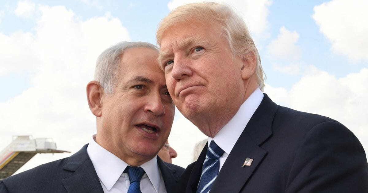 Israeli Prime Minister Benjamin Netanyahu speaks with U.S. President Donald Trump on May 23, 2017, in Jerusalem, Israel.
