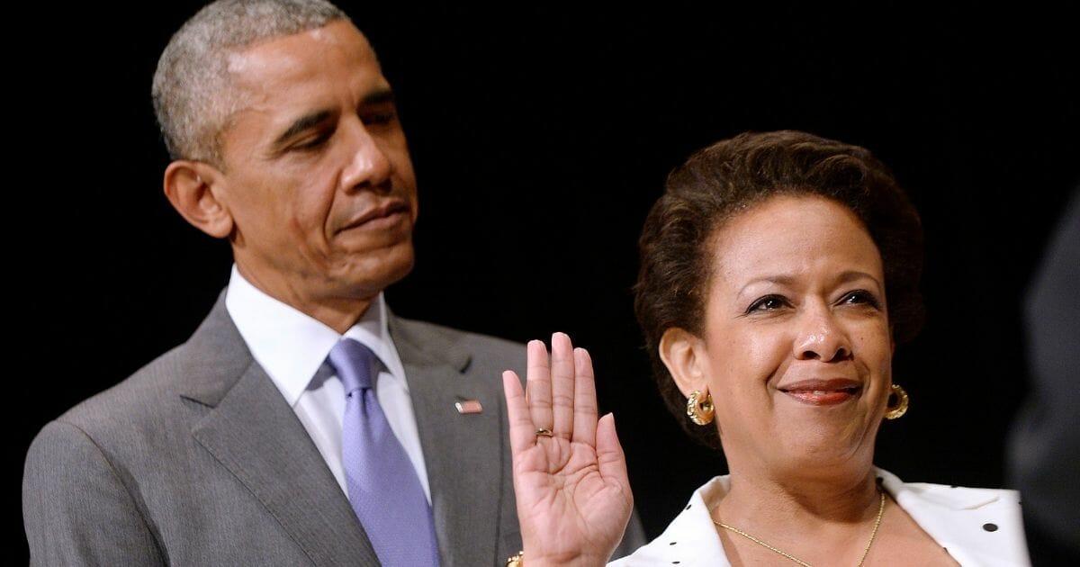 Loretta Lynch is sworn in during a formal investiture ceremony as Barack Obama observes at the Warner Theatre on June 17, 2015, in Washington, D.C.