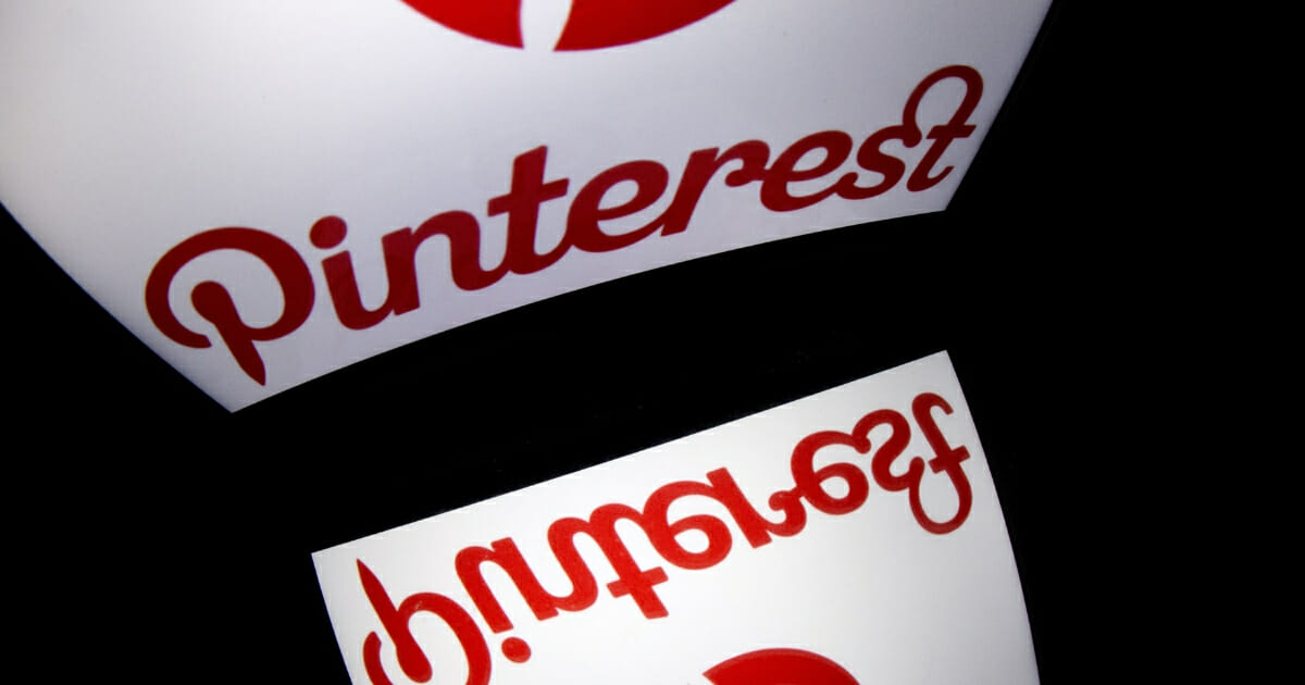 The logo of mobile app "Pinterest" is displayed on a tablet on Jan. 2, 2014 in Paris.
