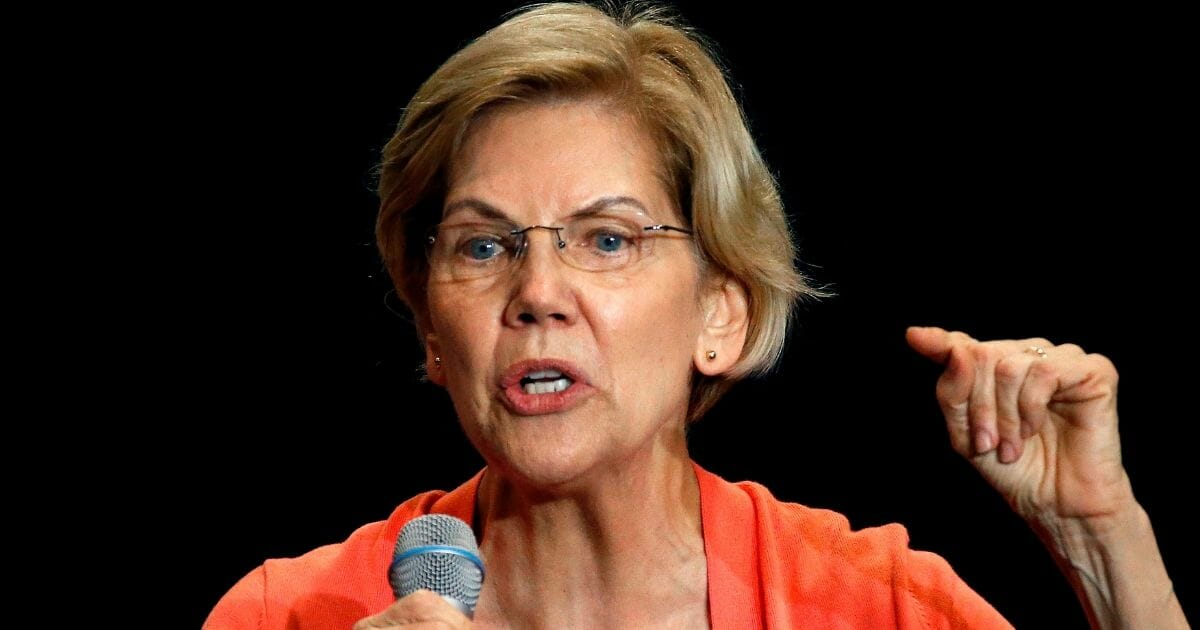 Sen. Elizabeth Warren gestures during a town hall meeting on June 25, 2019, in Miami, Fla.