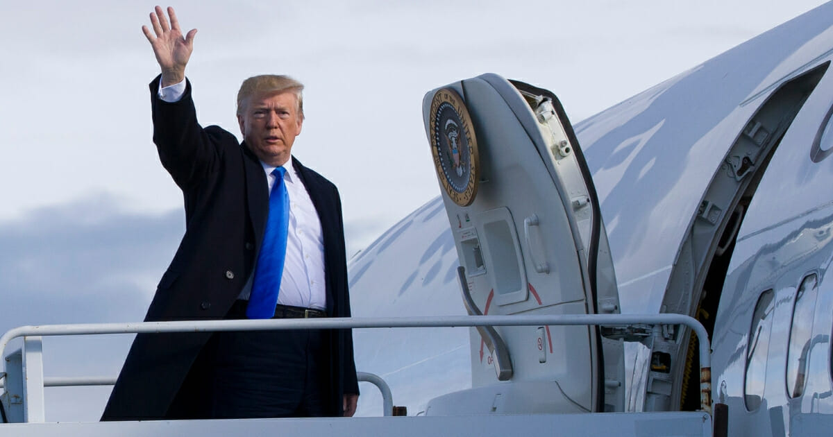 President Donald Trump waves as he boards Air Force One before he departs Shannon Airport on June 6, 2019, in Shannon, Ireland.