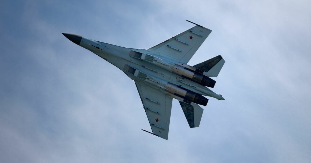 A Russian Sukhoi Su-35 flies over Le Bourget airport, north of Paris, on June 17, 2013 on the opening day of the International Paris Air show.