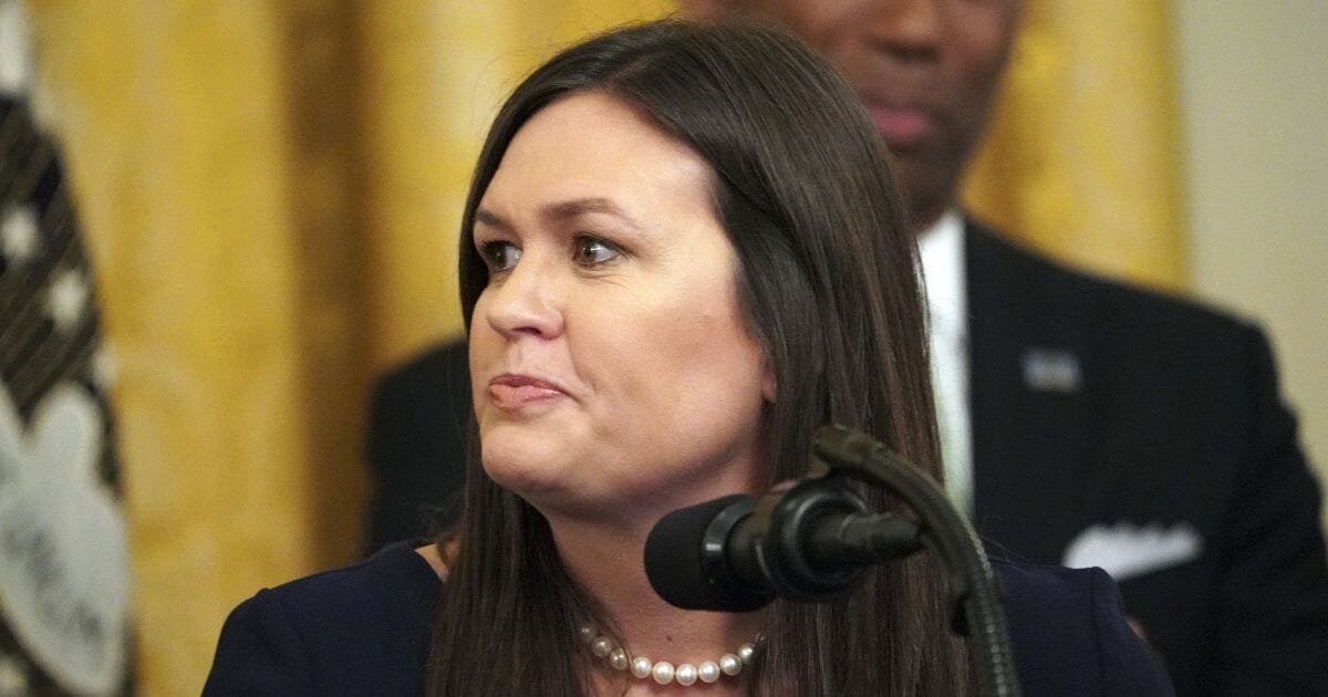Sarah Sanders listens during an event in the East Room of the White House in Washington, D.C., on June 13, 2019.