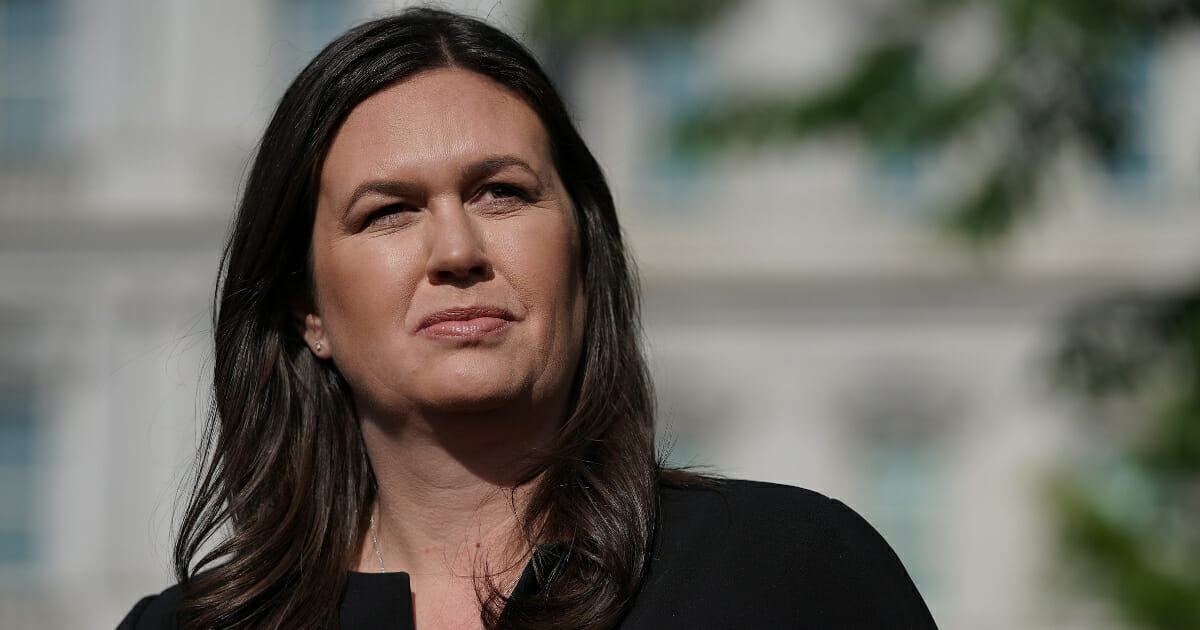 Outgoing White House press secretary Sarah Sanders talks to reporters after being interviewed on Fox News outside the White House April 29, 2019 in Washington, D.C.