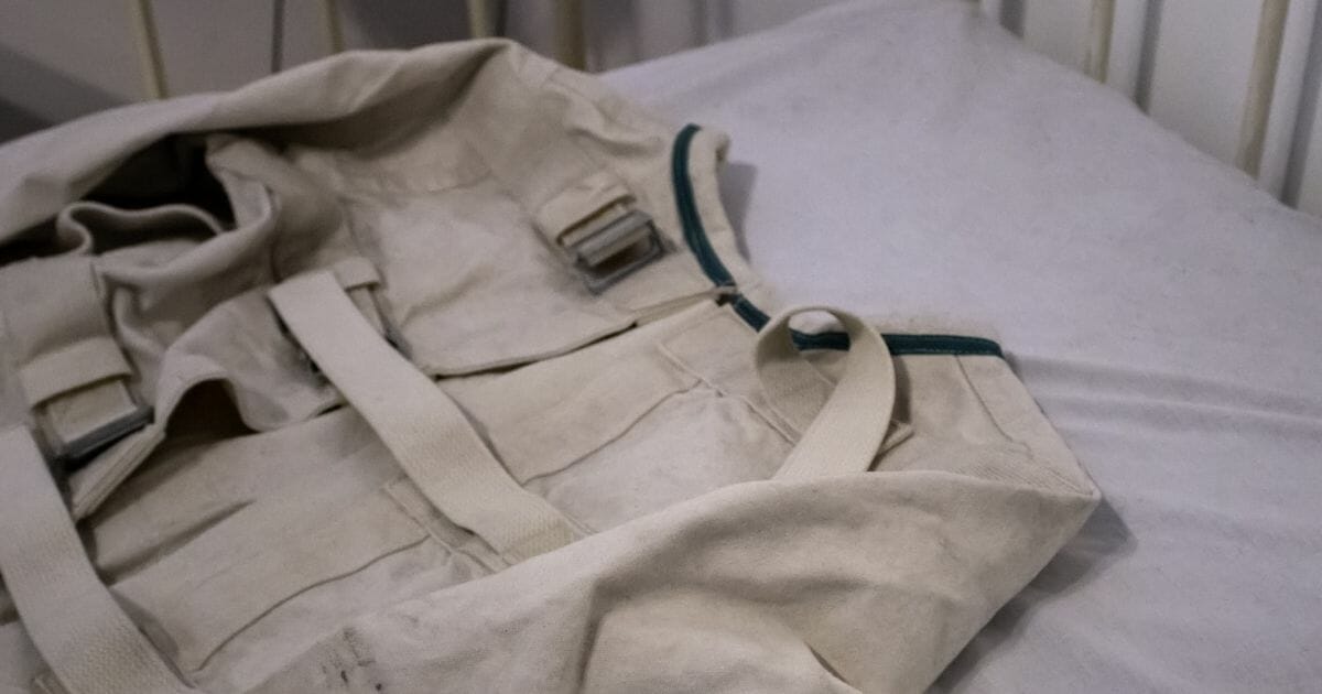 A straitjacket on a psychiatric hospital bed
