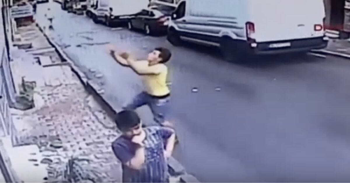 Teen reaches arms out to catch falling child