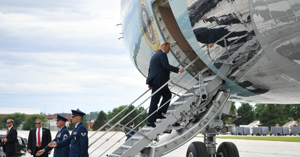 President Donald Trump boards Air Force One before departing from Offutt Air Force Base in Nebraska on June 11, 2019.
