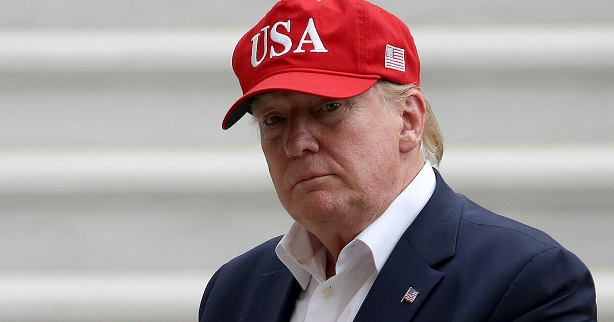 President Donald Trump in "USA" hat.