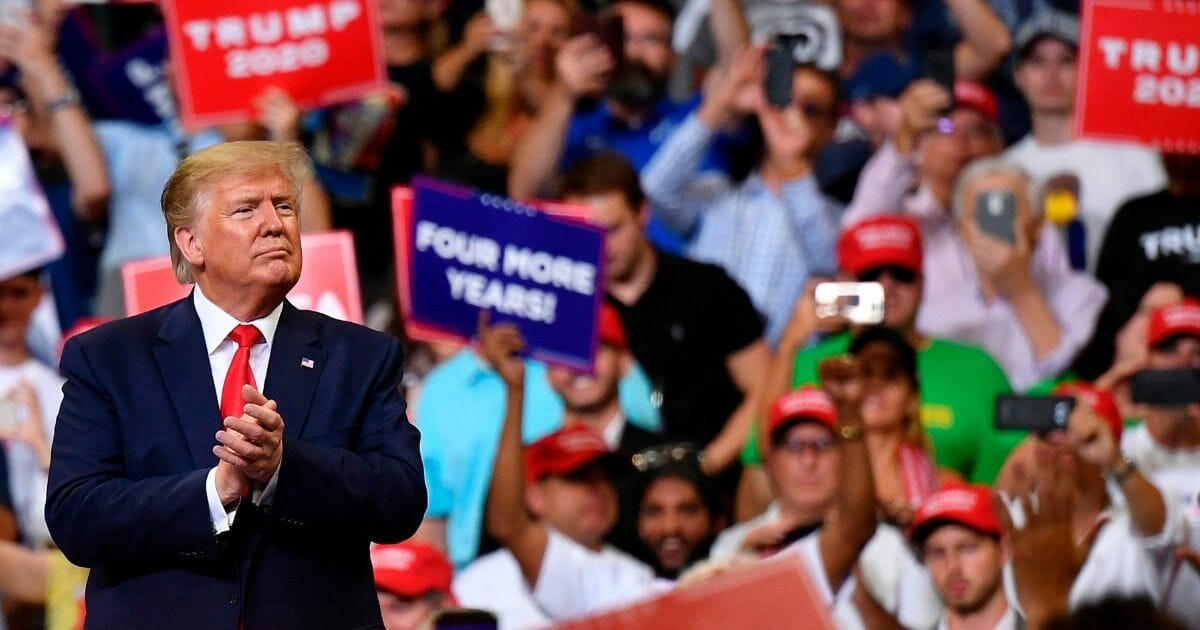 President Donald Trump is cheered by the crowd Tuesday at his re-election campaign kickoff rally in Orlando, Florida. Early in Trump's speech, the crowd broke into a chant of "CNN sucks!"