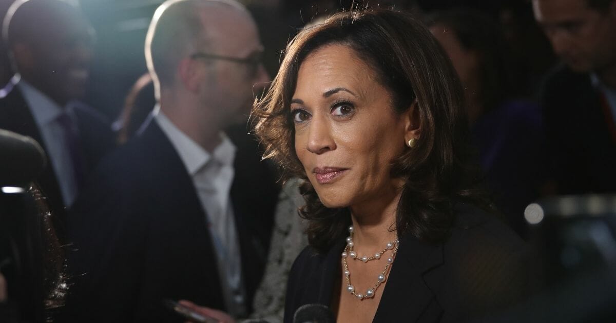 Kamala Harris speaks to reporters after Thursday's Democratic primary debate.