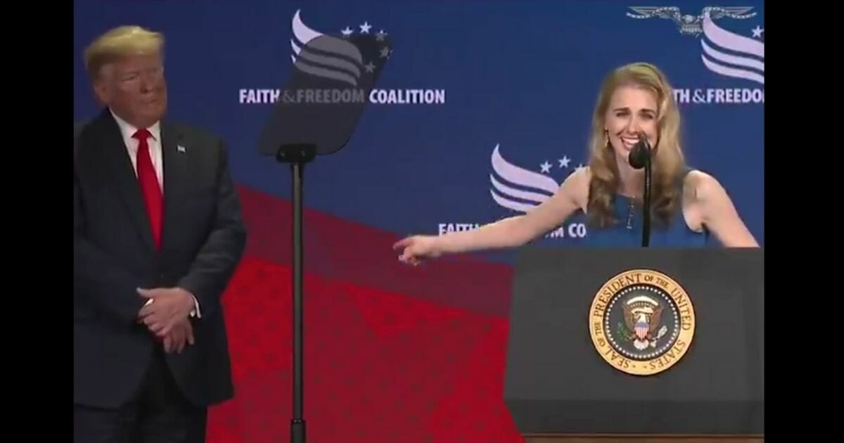 Cancer survivor Natalie Harp thanks President Donald Trump at the Faith and Freedom Coalition conference