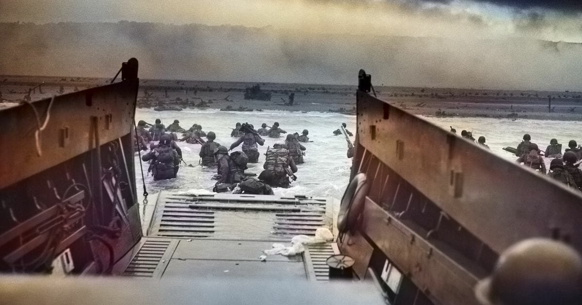 A digitally colorized image of "Into the Jaws of Death" of the U.S. Army First Infantry Division disembarking from an LCVP onto Omaha Beach during the Normandy landings on June 6, 1944.