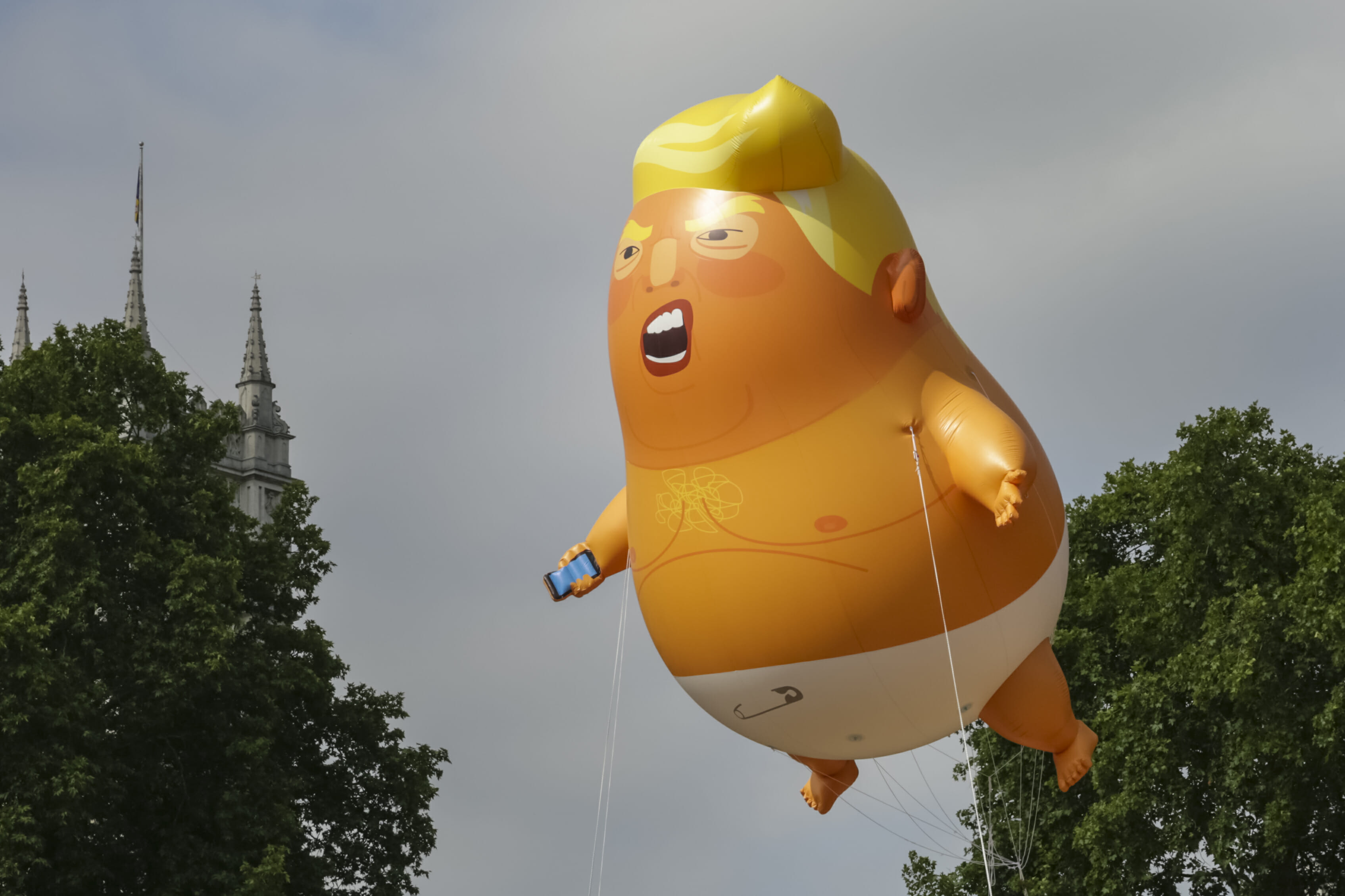 A giant baby trump balloon flies over the Parliament Square on July 13, 2018 in London, England.