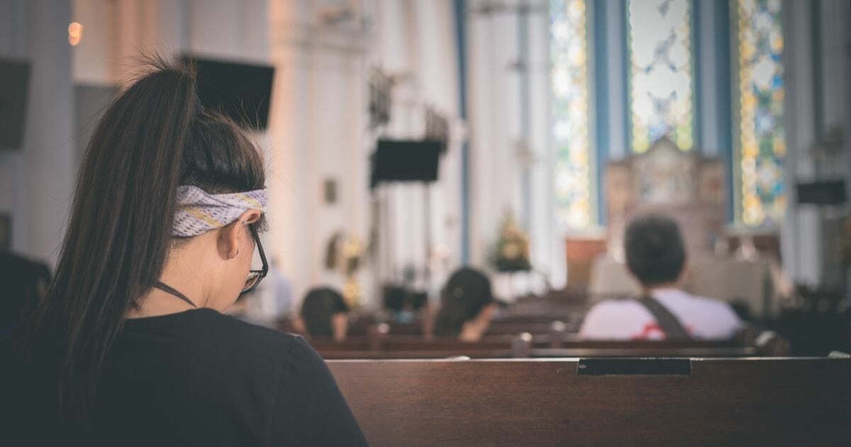 Girl in church pews