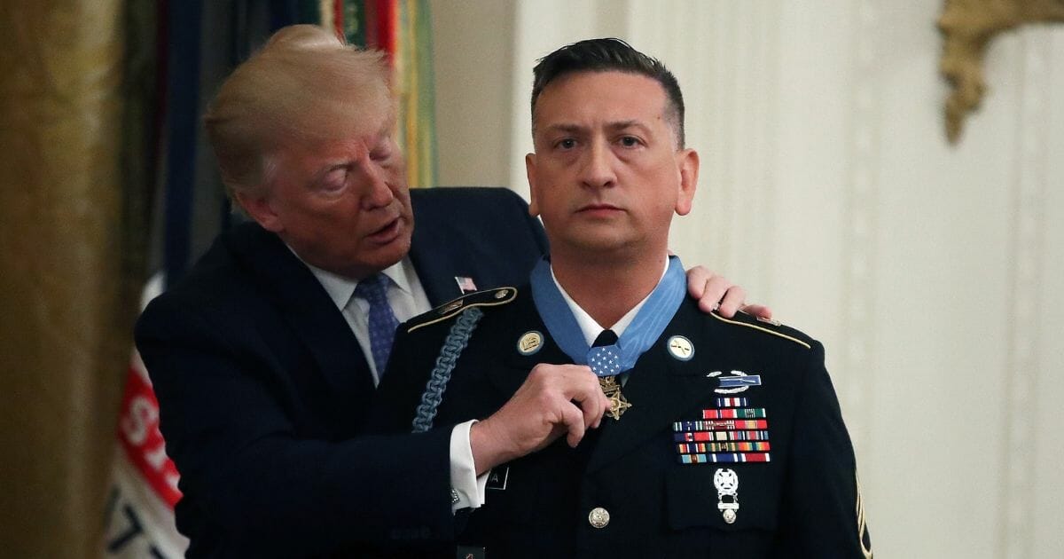 U.S. President Donald Trump presents the Medal of Honor the U.S. Army Staff Sgt. David Bellavia Ret., during a ceremony in the East Room at the White House, on June 25, 2019, in Washington, D.C.