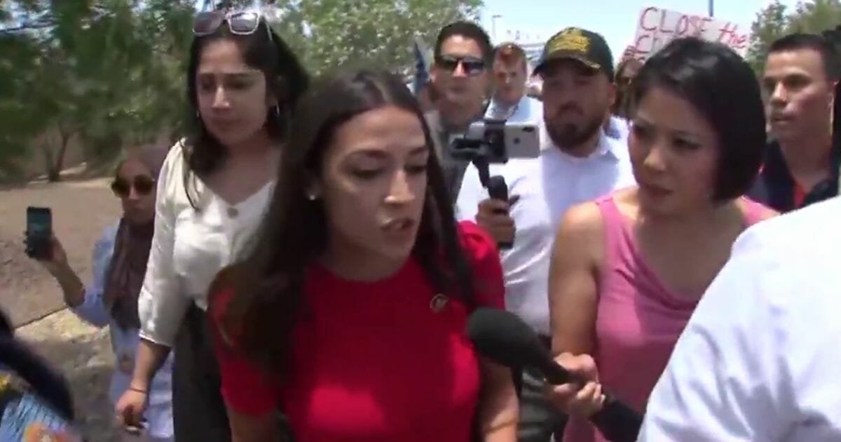 Rep. Alexandria Ocasio-Cortez speaks to a reporter at the southern border on Monday, July 1, 2019, in El Paso, Texas.