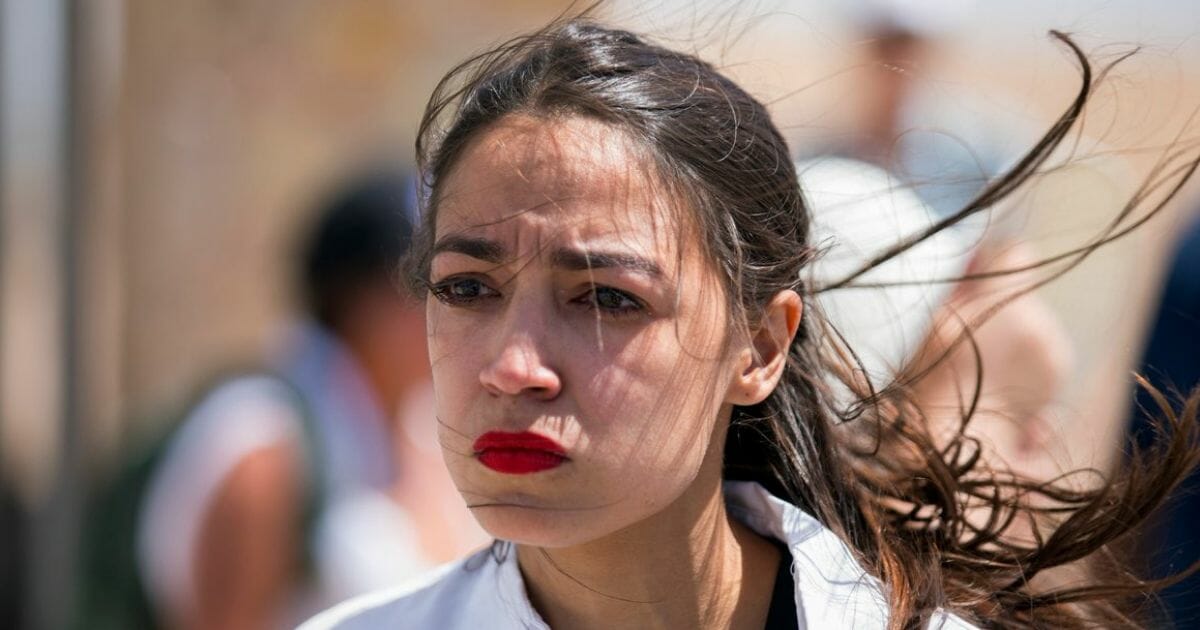 Rep. Alexandria Ocasio-Cortez cries at a facility for migrants in Tornillo, Texas, on June 24, 2018.