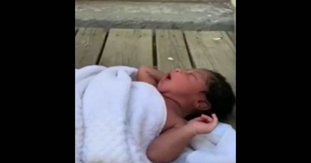 An abandoned baby was found on a porch in 93 degree heat.