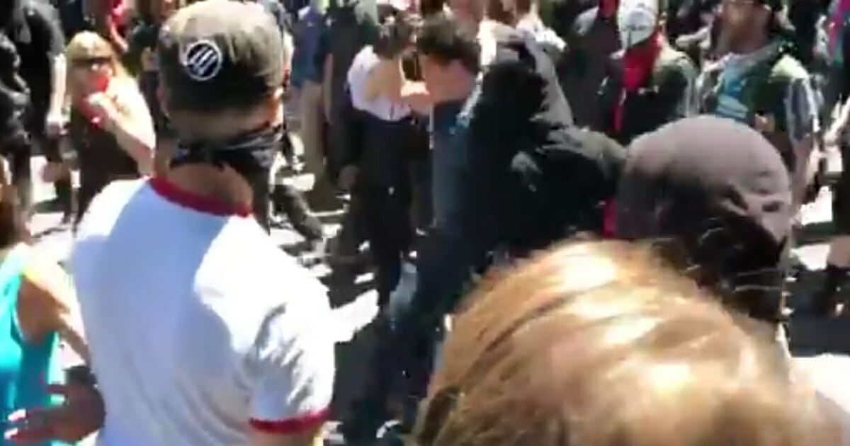 Antifa protesters attack journalist Andy Ngo during a rally in Portland, Oregon.