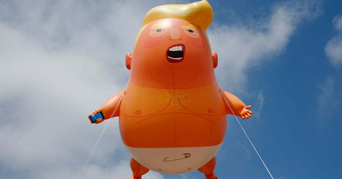 The Baby Trump balloon flies in London.