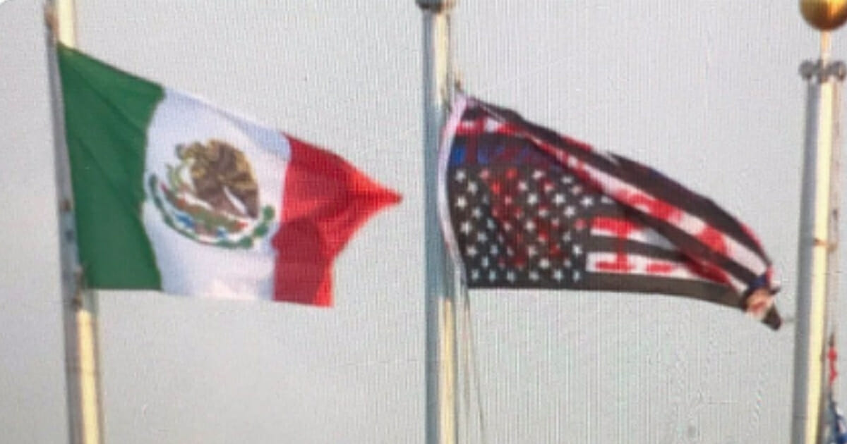 Anti-Donald Trump protesters were caught on video Friday taking down a United States flag outside of an Immigration and Customs Enforcement building in Aurora, Colorado, and replacing it with a Mexican flag.
