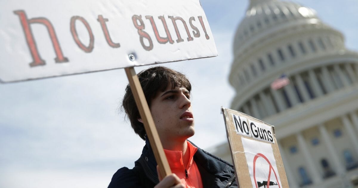 Student Maximilian Steubl participates in a gun-control rally in front of the U.S. Capitol on March 14, 2019, in Washington, D.C.