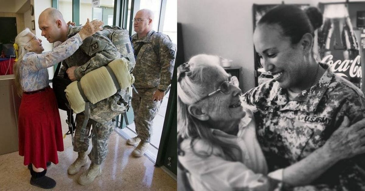 elderly woman hugging military service members