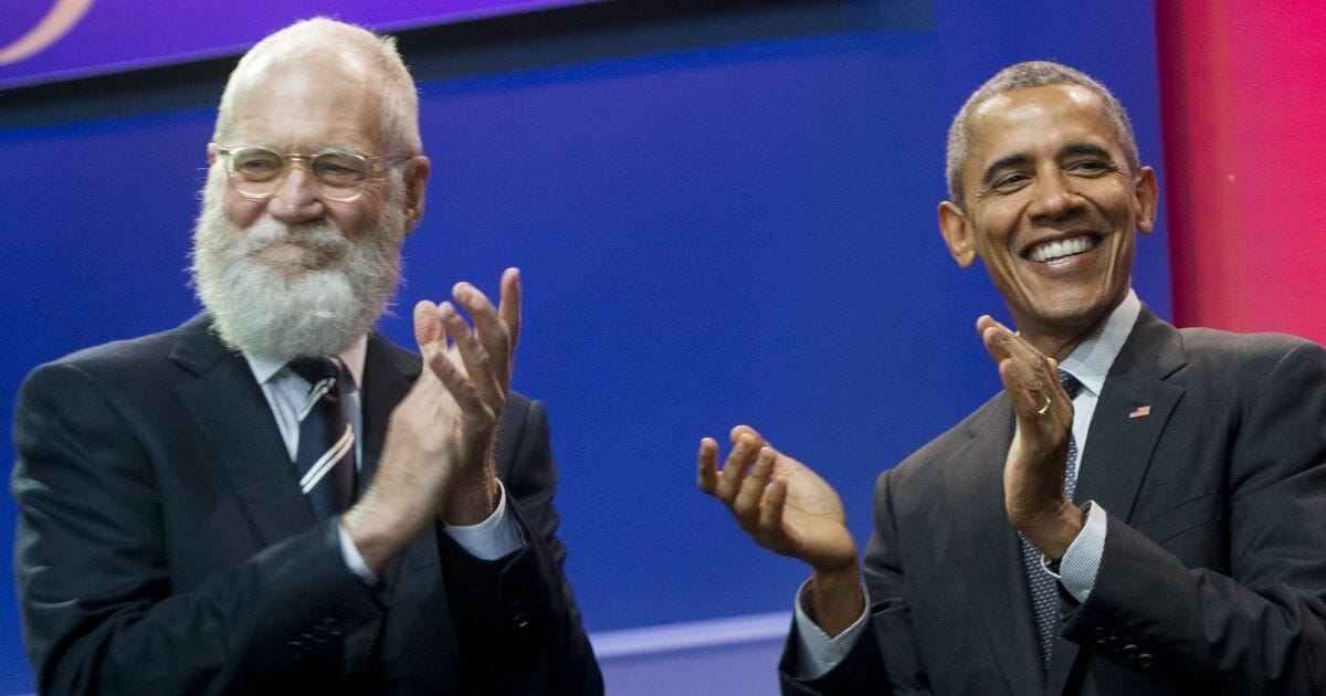 Netflix talk-show host David Letterman, left, and former President Barack Obama -- shown applauding at Andrews Air Force Base in Maryland on May 5, 2016 -- have joined forces on Netflix. The media-services provider has welcomed the Obamas to produce programs and embraced a leftist agenda, losing subscribers in the process.