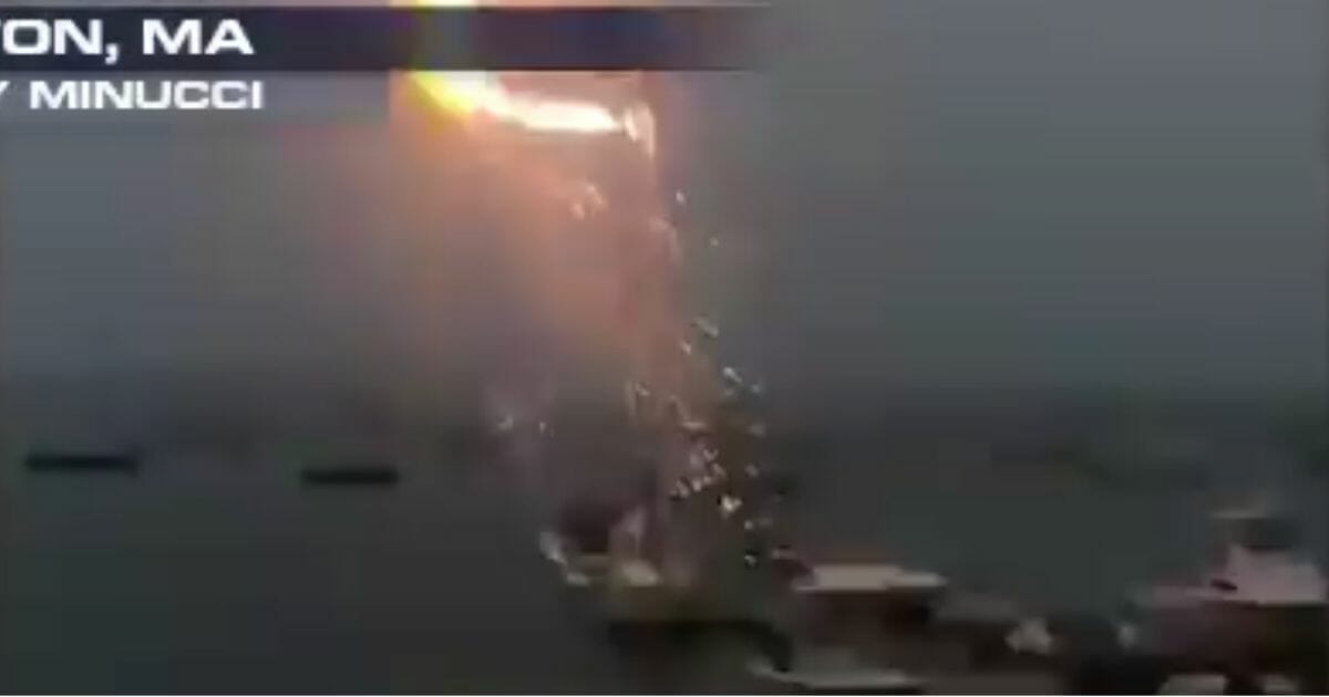 Lightning hits a man's boat Saturday, July 6, near Boston, Mass.