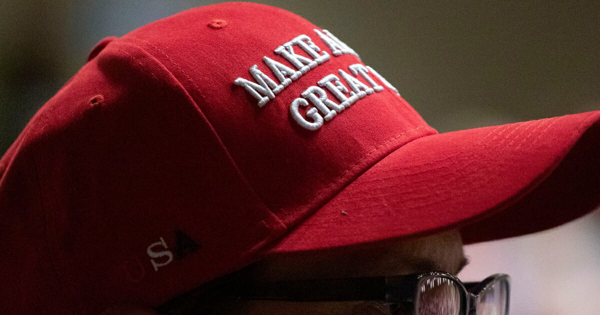 Diane Luke of Grand Rapids, Michigan, wears a Make America Great Again hat while questioning Rep. Justin Amash at a town hall meeting on May 28, 2019 in Grand Rapids, Michigan.