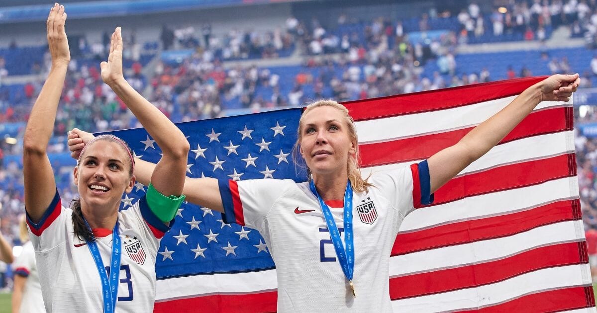 Alex Morgan, left, and Allie Long celebrate Sunday, July 7, 2019, after their U.S. soccer team defeated the Netherlands in the Women's World Cup championship match in Lyon, France.