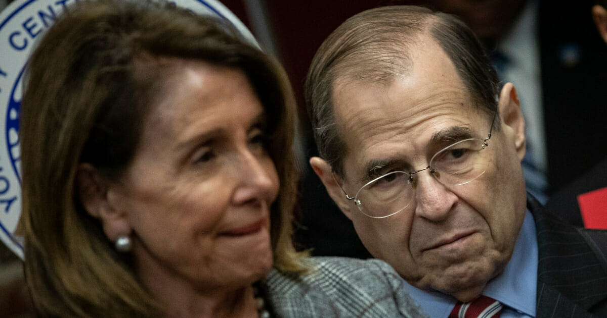 Speaker of the House Nancy Pelosi of California, left, and House Judiciary Committee Chairman Rep. Jerrold Nadler of New York observe during a news conference to discuss the American Dream and Promise Act at the Tenement Museum, March 20, 2019, in New York City.