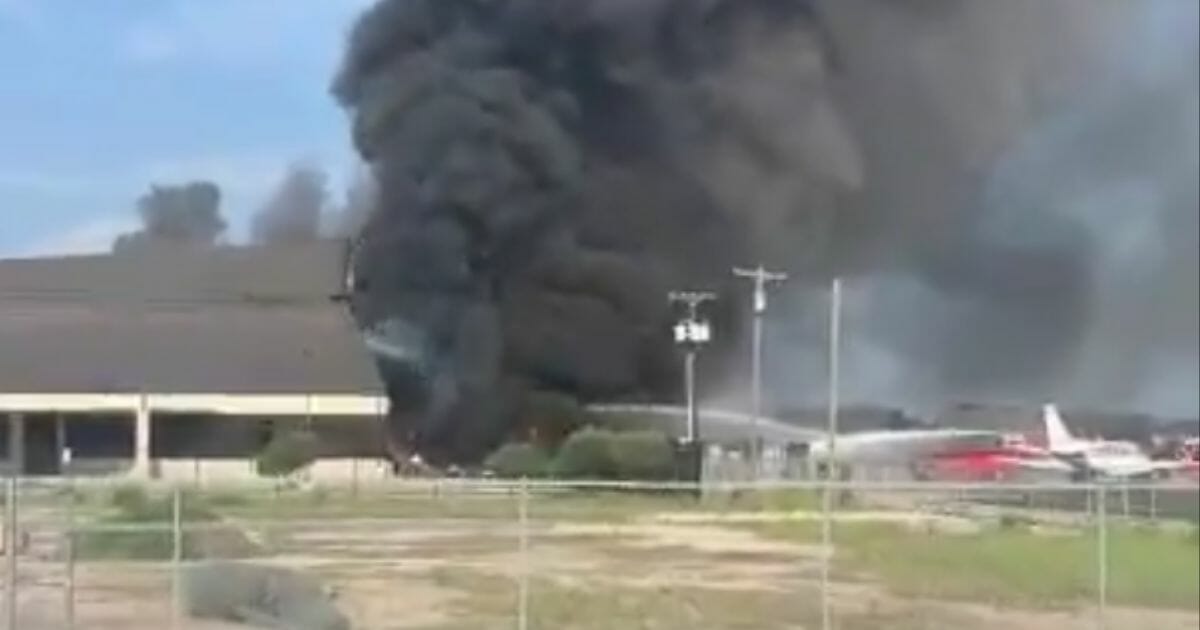A small plane crashed into a hangar Sunday in Addison, Texas, killing all 10 people on board.