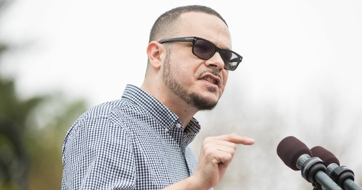 Shaun King introduces Democratic presidential candidate Bernie Sanders during a rally on May 25, 2019, in Montpelier, Vt.