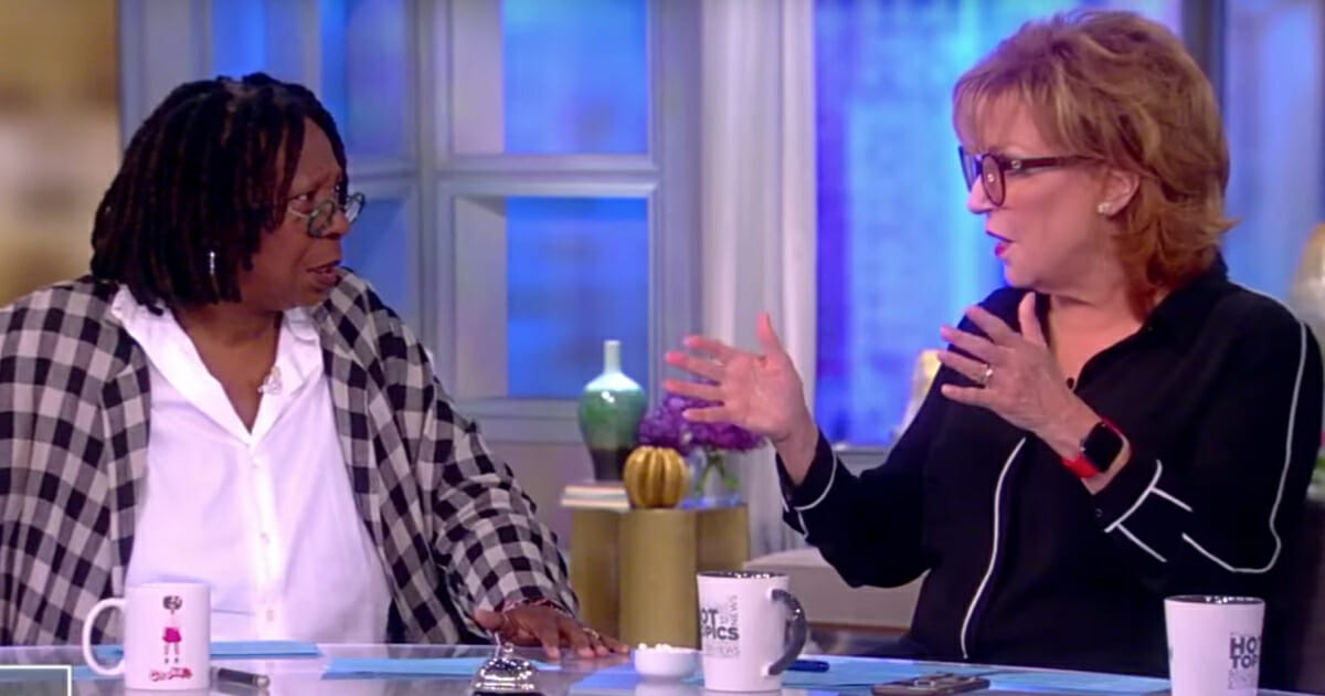 Whoopi Goldberg, left, and Joy Behar discuss President Donald Trump's description of Rep. Elijah Cummings as "racist" on ABC's "The View."