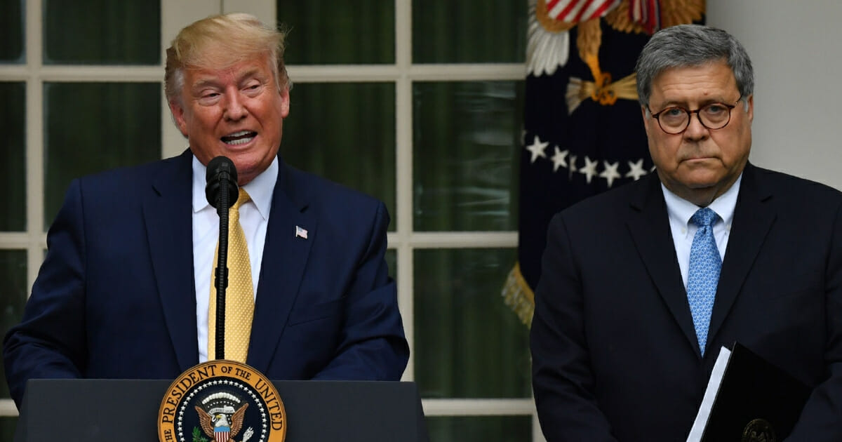 President Donald Trump speaks at a news conference with Attorney General William Barr in the White House Rose Garden.