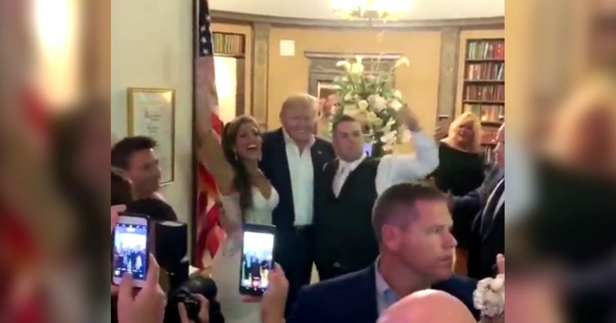 President Donald Trump surprises a couple by showing up at their wedding at Trump National Golf Club Bedminster in New Jersey.