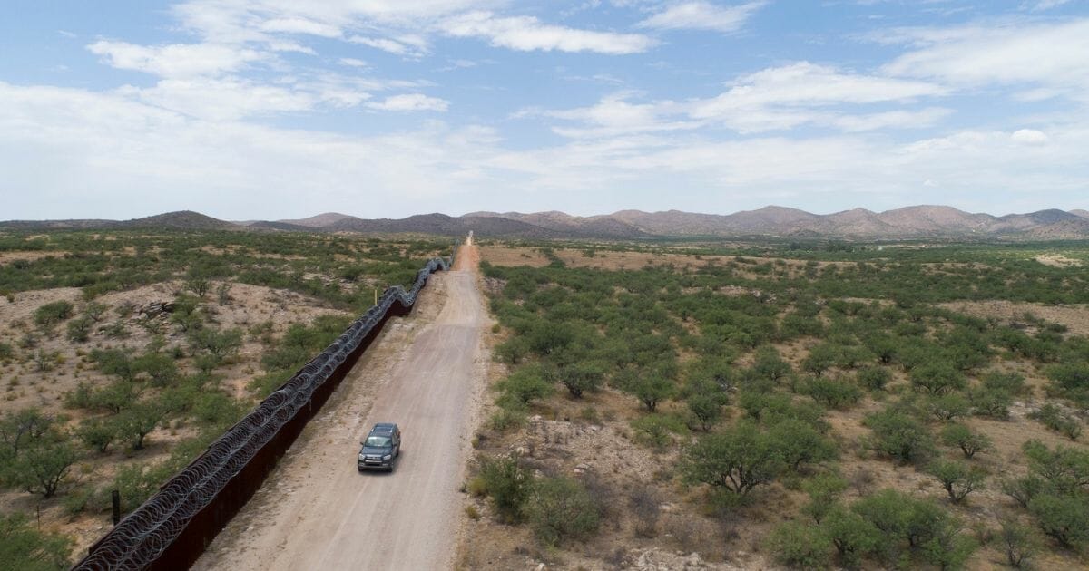 A Green Valley-Sahuarita Samaritans vehicle patrols the border fence in Sasabe, Arizona, on July 14, 2019.