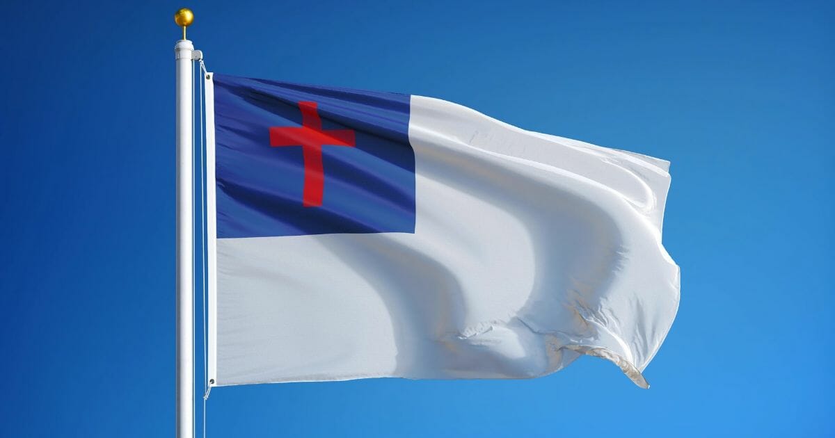 Christian flag - white with a red cross on a blue background in the upper left corner.